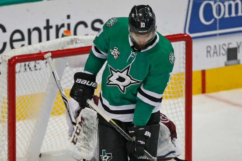 Dallas Stars center Martin Hanzal (10) tries to block the goalie's view and deflect the puck...
