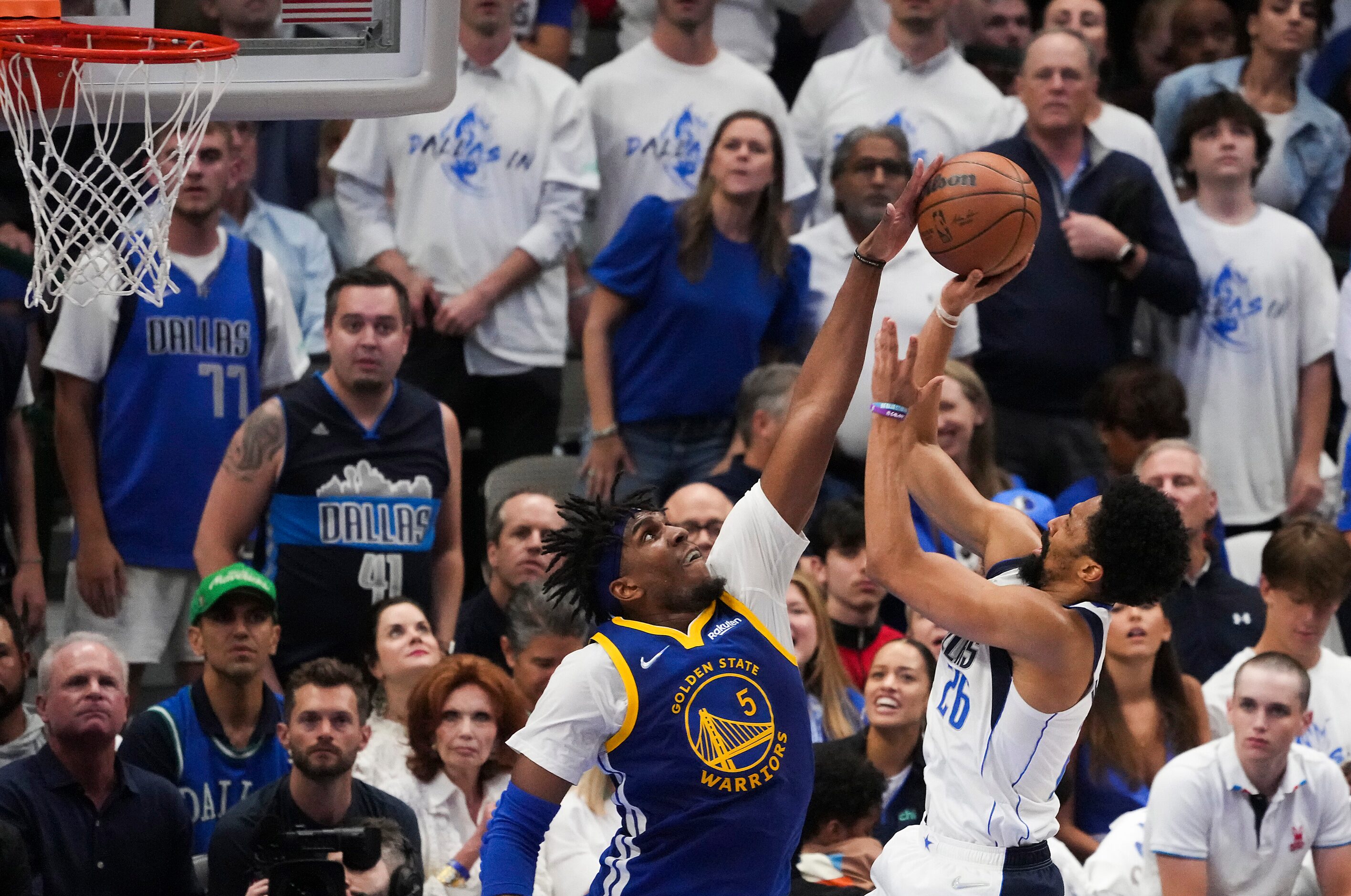 Golden State Warriors center Kevon Looney (5) blocks a shot by Dallas Mavericks guard...