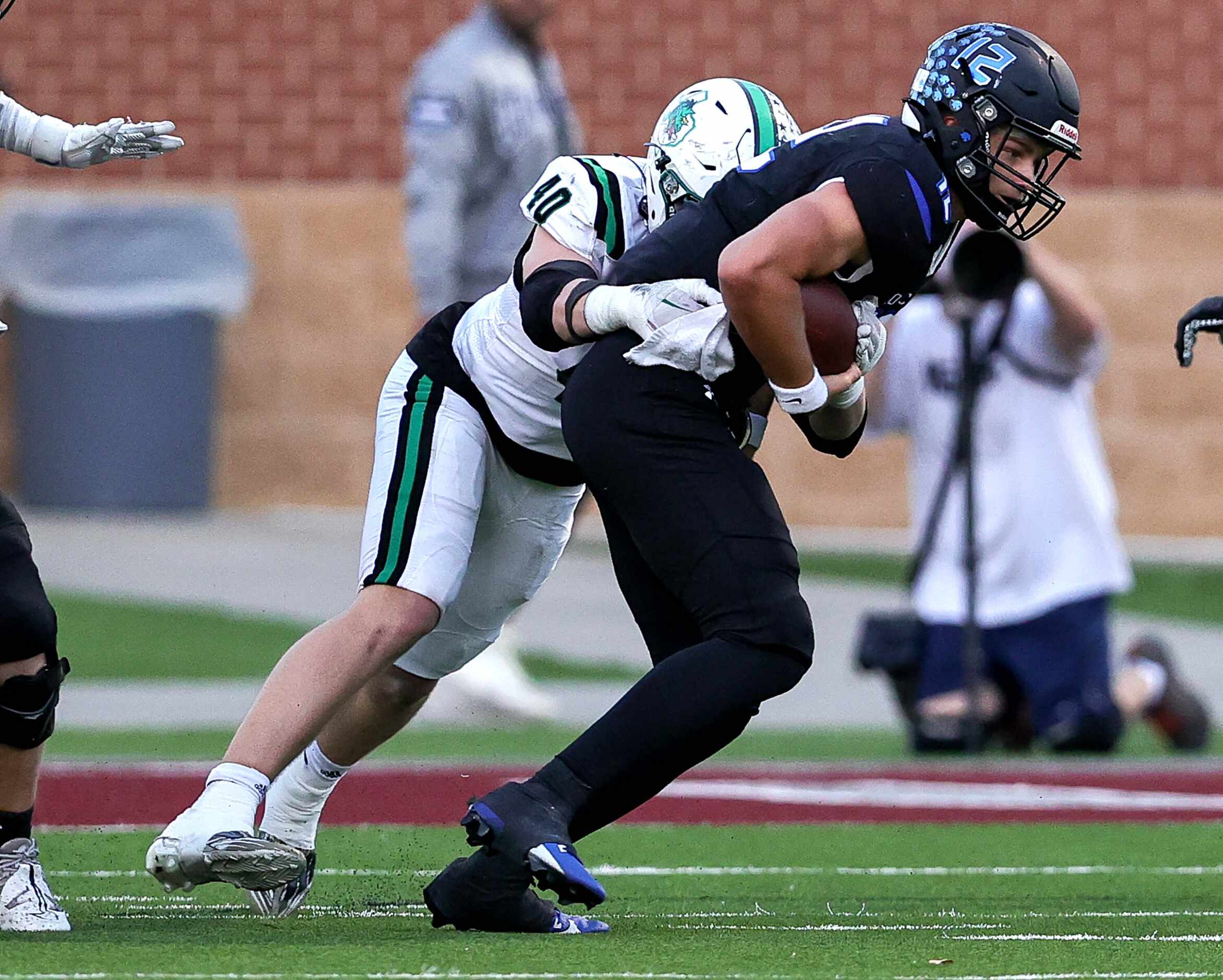 Byron Nelson quarterback Tom Von Grote (12) tries to scramble but is stopped by Southlake...