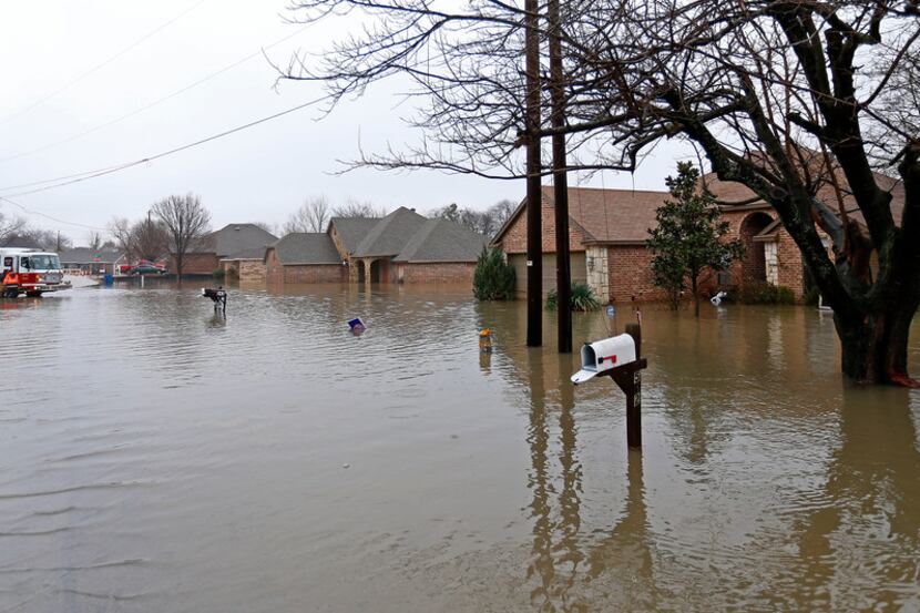 Houses on Lakeside Drive are flooded from Rockwall Lake in late February.