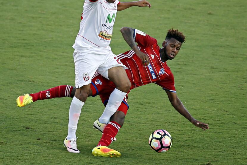 Real Esteli's Gregorio Torres (left) collides with FC Dallas' Kellyn Acosta during the first...