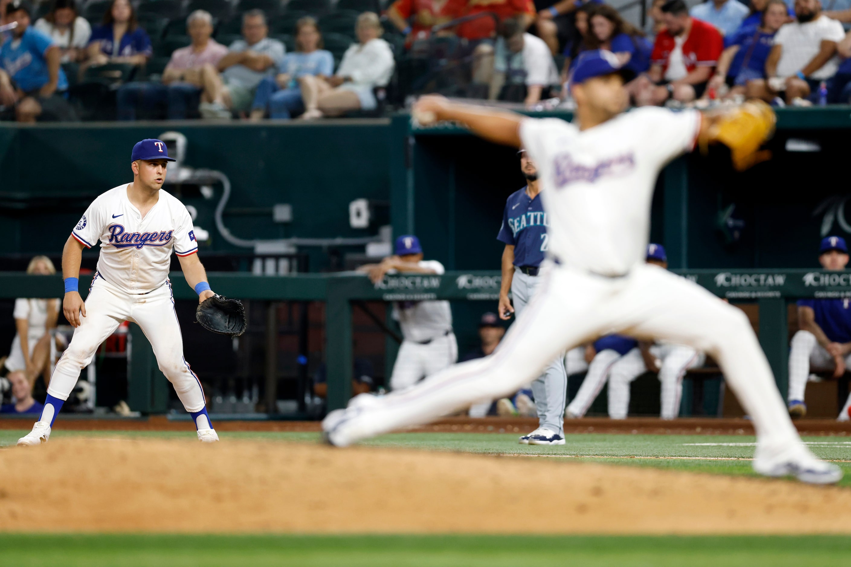 Texas Rangers first baseman Nathaniel Lowe (30) watches a pitch by pitcher Gerson Garabito...