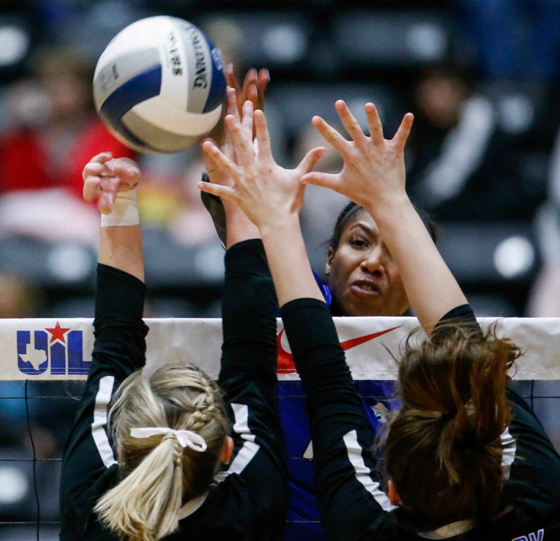 Trophy Club Byron NelsonÃs Charitie Luper (10) hits the ball over the net in the first set...