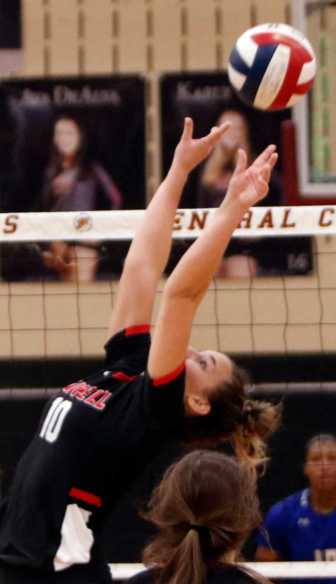 Coppell setter Kinsey Bailey (10) sets a teammate during the second game of their match...