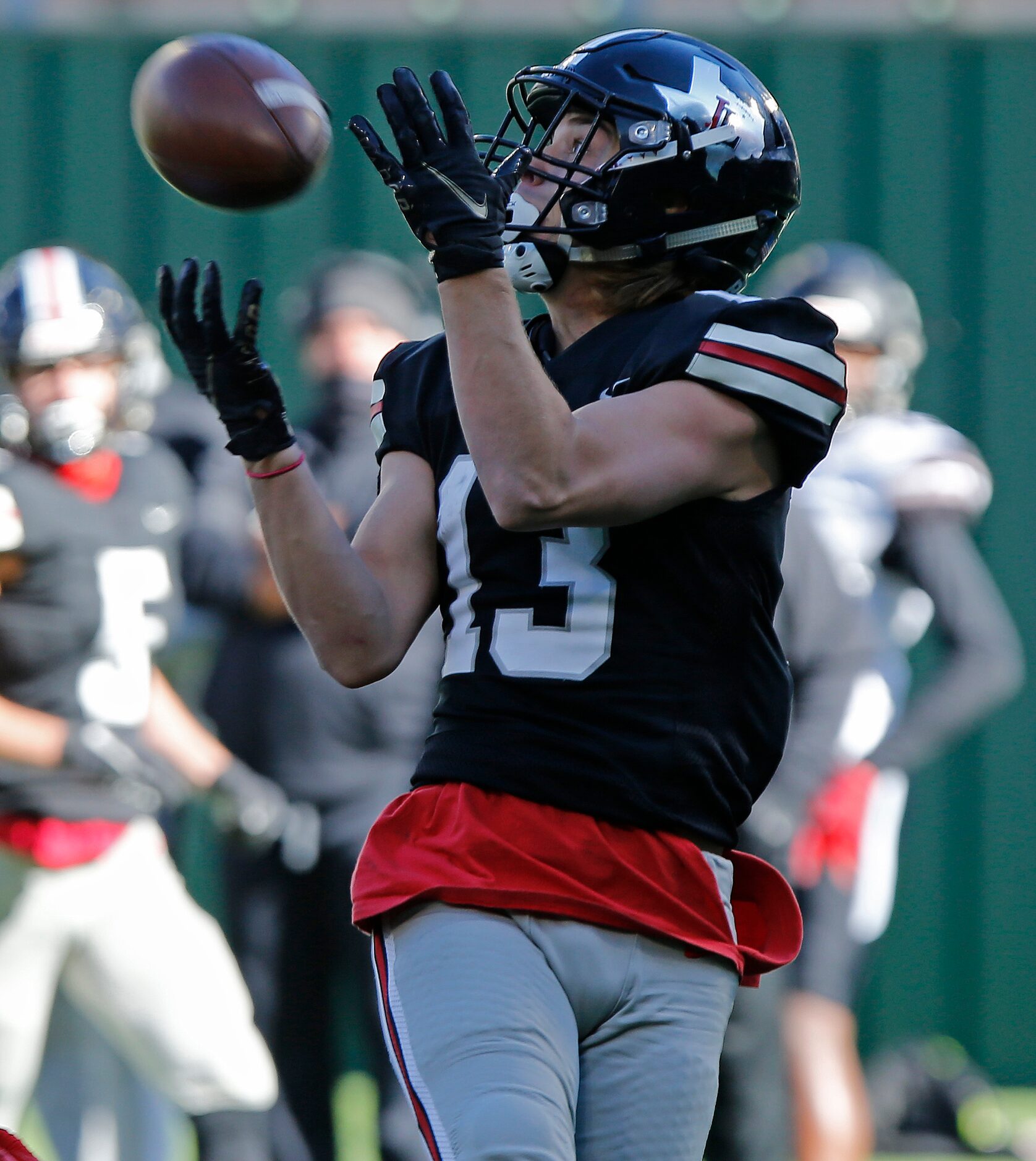 Lovejoy High School wide receiver Luke Mayfield (13) catches a touchdown pass in the second...