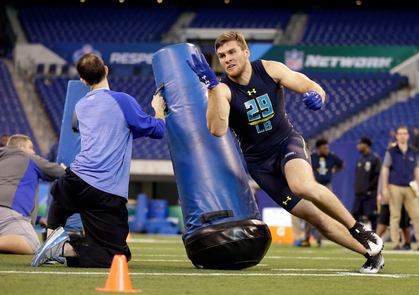 Wisconsin linebacker T.J. Watt runs a drill at the NFL football scouting combine in...