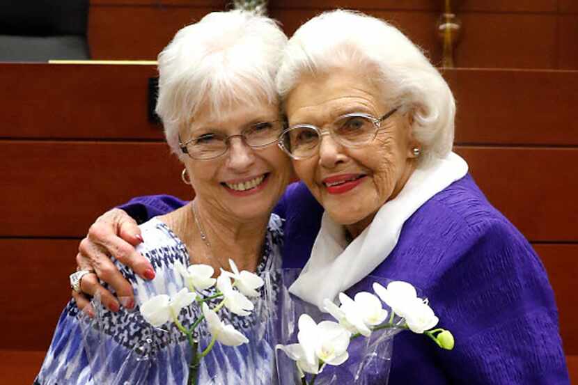 Mary Smith, 76, left, and Muriel Clayton, 92, hug after Muriel legally adopted Mary, who she...