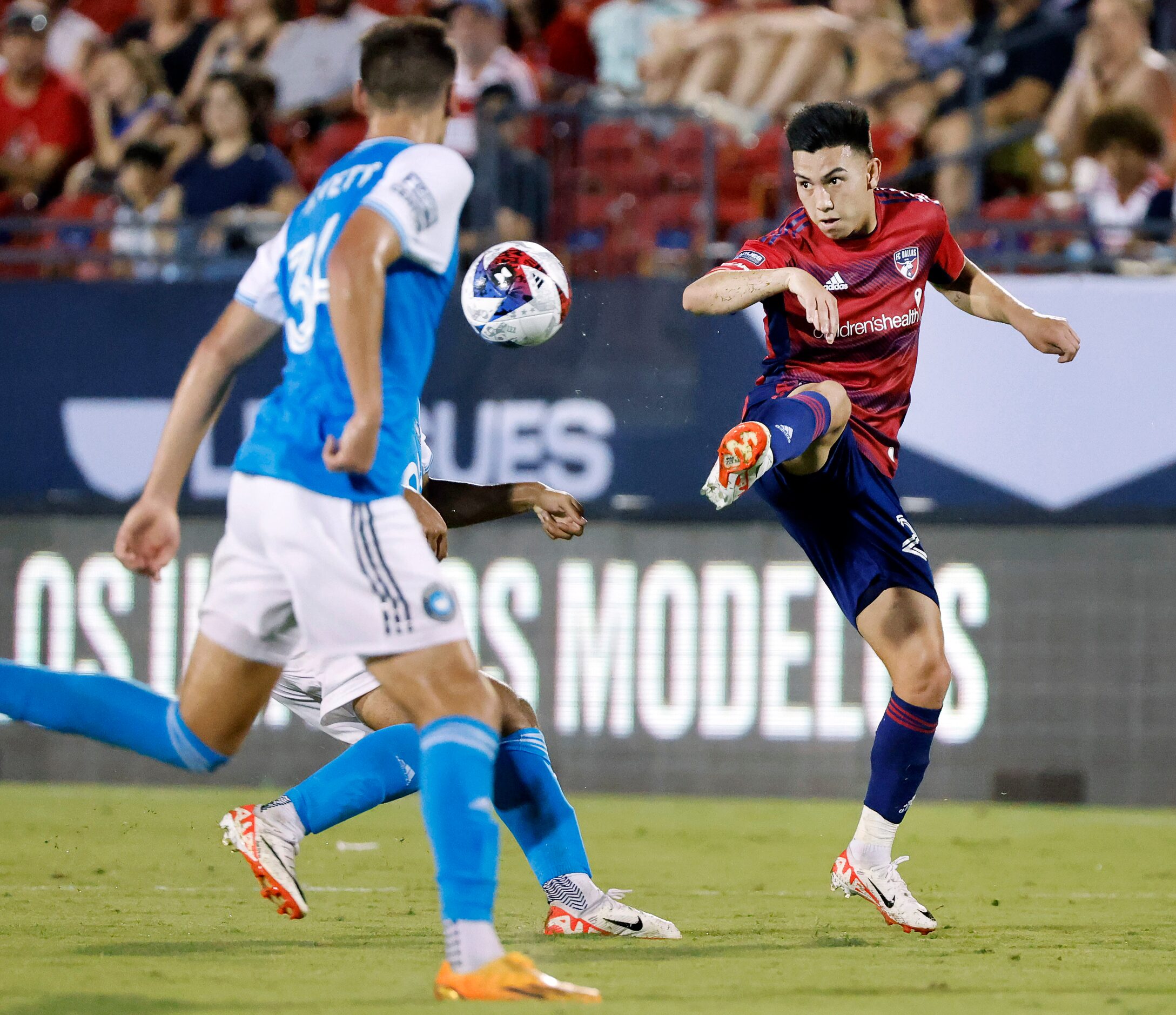 FC Dallas forward Alan Velasco (20) passes the ball against the Charlotte FC during the...