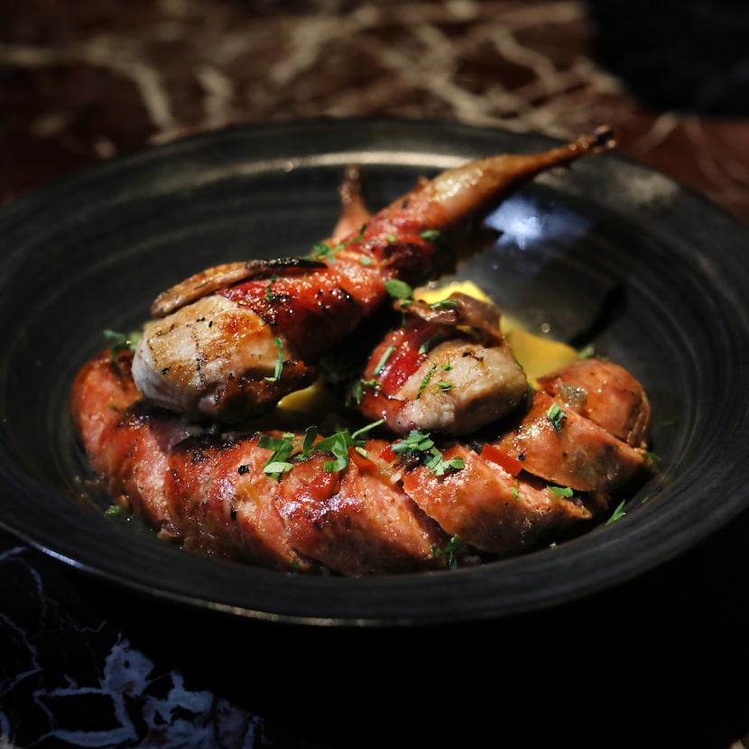 Quail scarpariello is a dish cooked over a binchotan charcoal grill at Bacari Tabu.