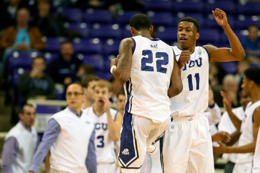 TCU Horned Frogs guard Jarvis Ray (22) and forward Brandon Parrish (11) celebrate during the...