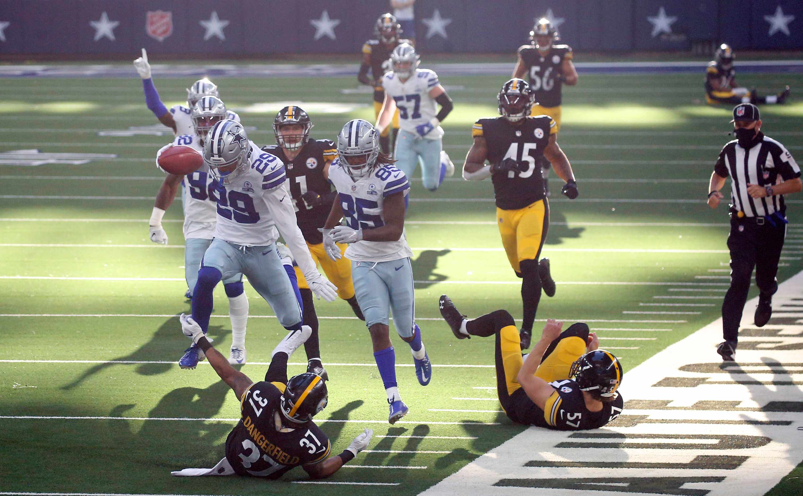 Dallas Cowboys cornerback C.J. Goodwin (29) leaps over Pittsburgh Steelers safety Jordan...