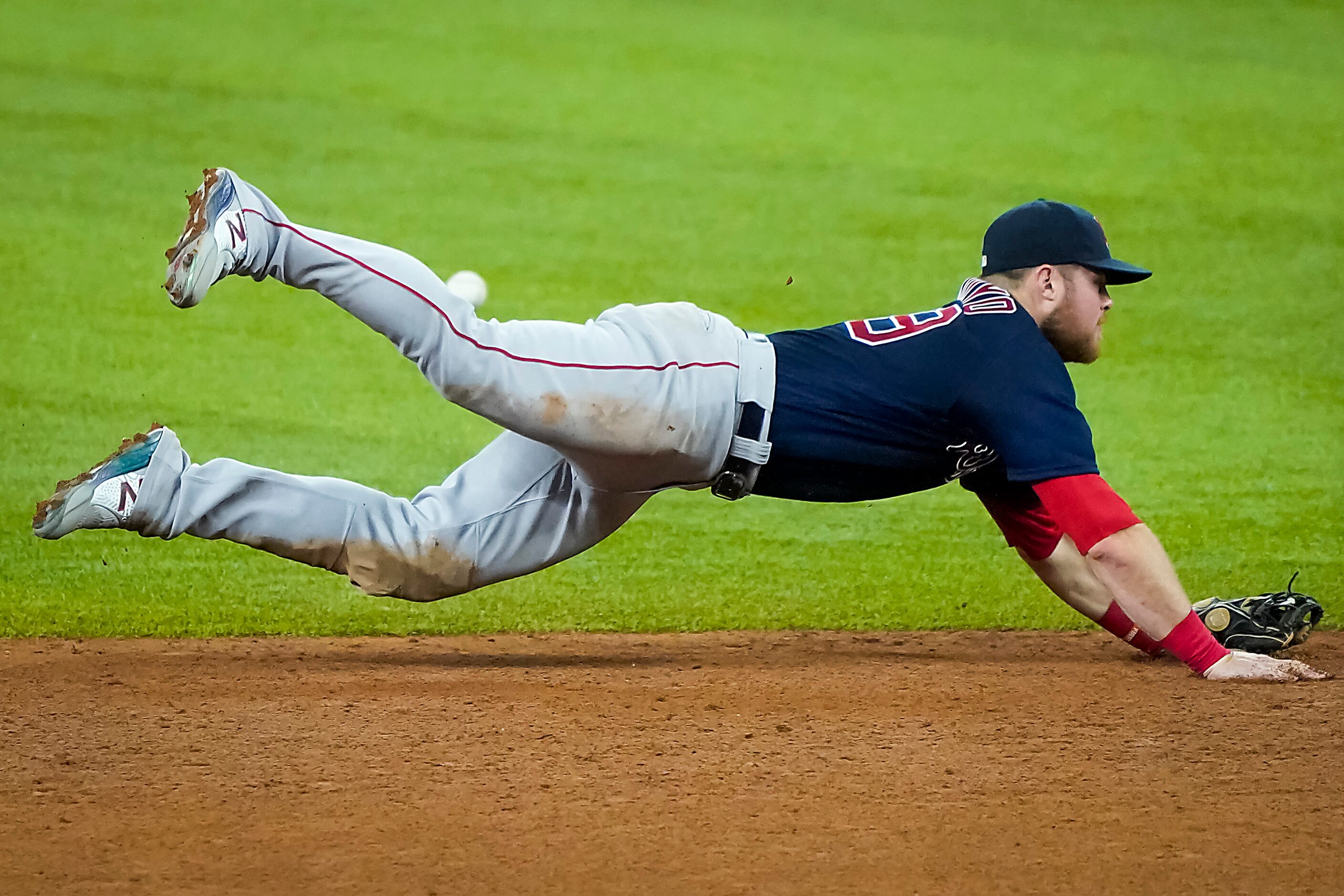 Boston Red Sox second baseman Christian Arroyo can’t make a diving play on a triple off the...