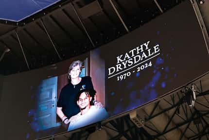 A big screen shows a photo of Mavericks rookie center Dereck Lively II, and his mother Kathy...