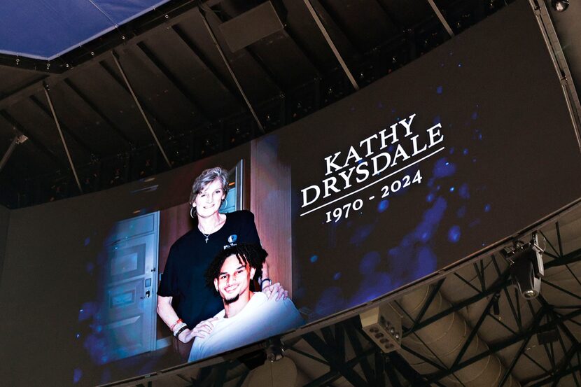 A big screen shows a photo of Mavericks rookie center Dereck Lively II, and his mother Kathy...