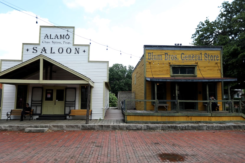 Two of the 1840-1910-era buildings relocated decades ago to Old City Park by the Dallas...