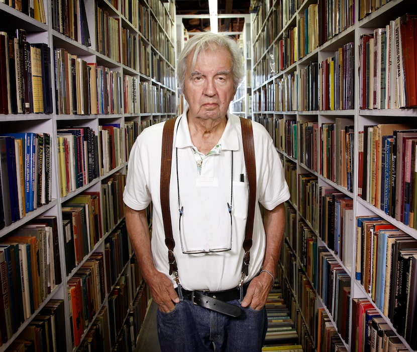 McMurtry poses in his Archer City bookstore during a liquidation sale in 2012.