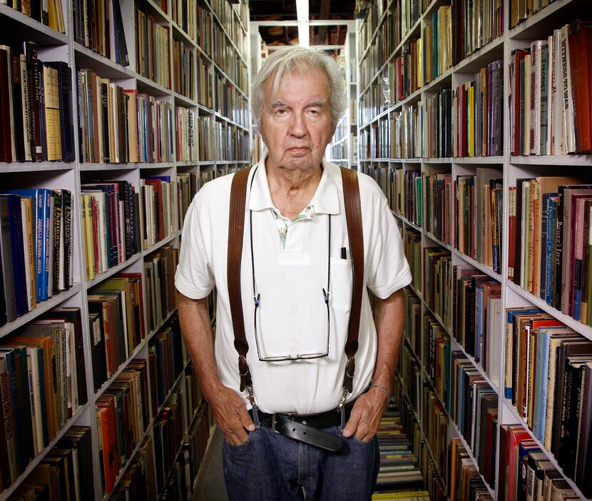 McMurtry poses in his Archer City bookstore during a liquidation sale in 2012.