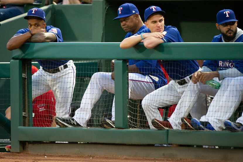 Texas Rangers outfielder Delino DeSheilds watches the game from the end of the dugout during...