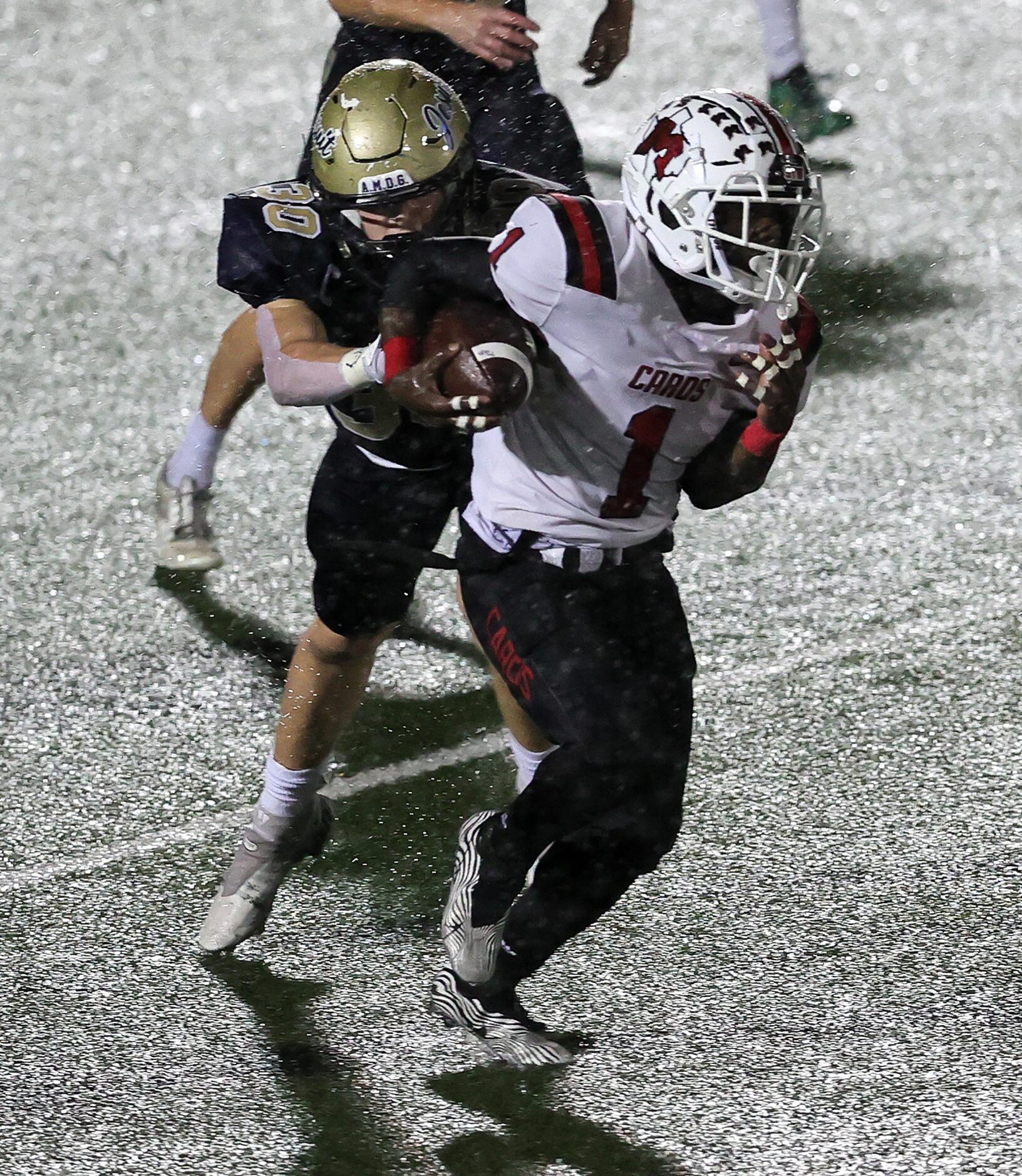 MacArthur running back Darelle Smith (1) gets past Jesuit linebacker Luke Buckner (30) for a...