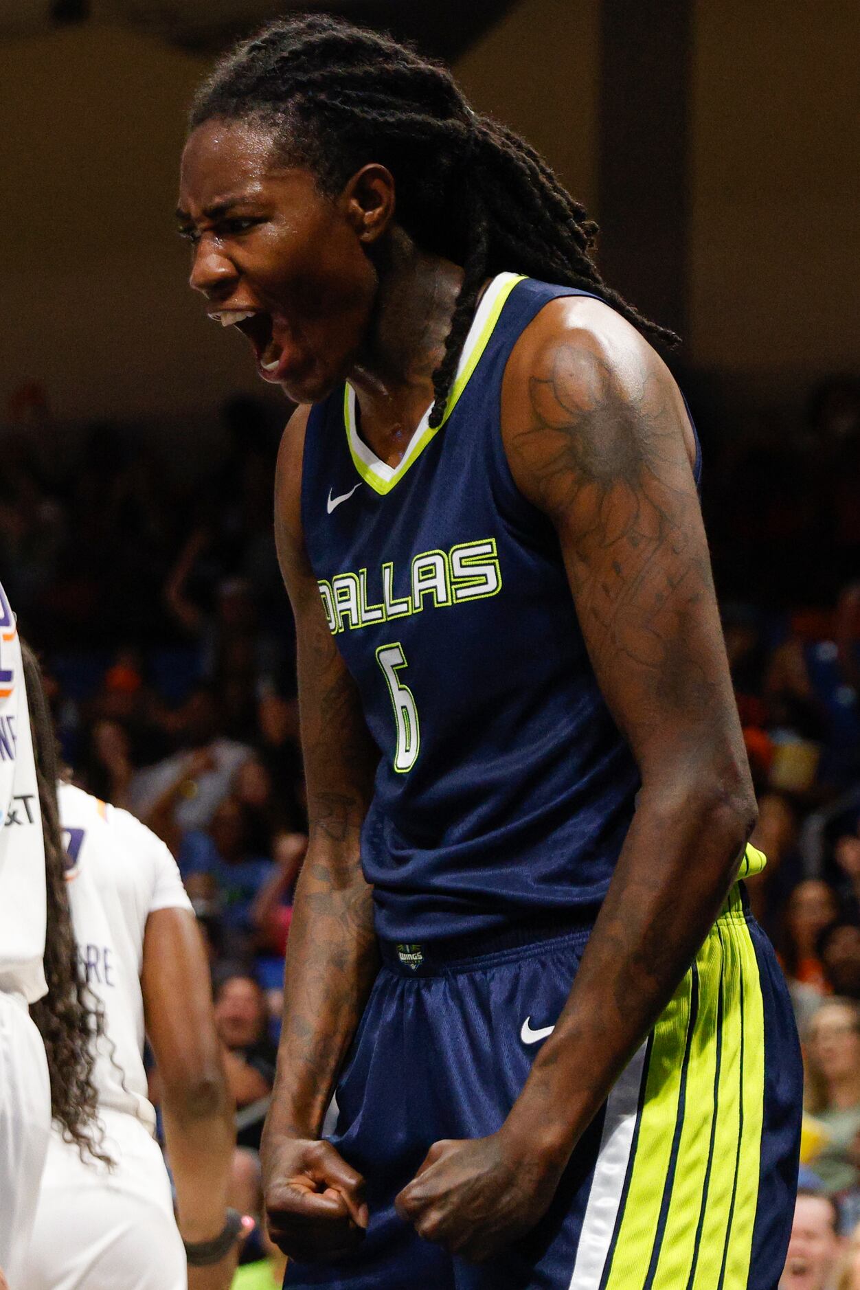 Dallas Wings forward Natasha Howard (6) reacts after making a basket while being fouled...