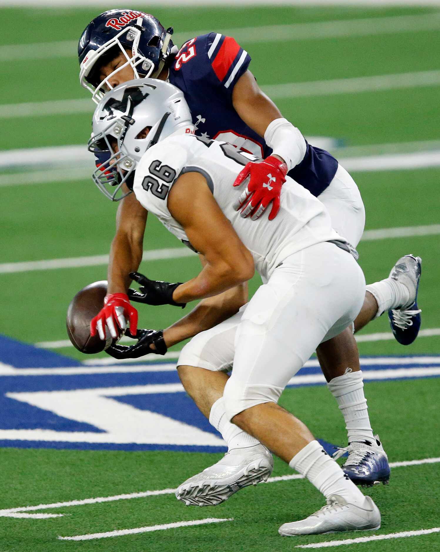 Denton Ryan defensive back James Lundy (23) breaks up a pass intended for Arlington Martin...