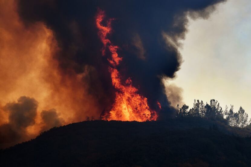 Flames engulfed a ridge near the town of Lakeport, Callf., in this summer's wildfires. 