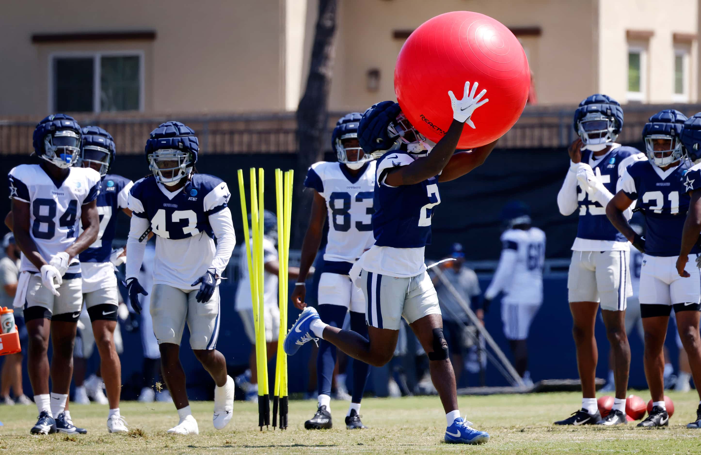 Dallas Cowboys cornerback Jourdan Lewis (2) scoopes up an exercise ball after hitting a...