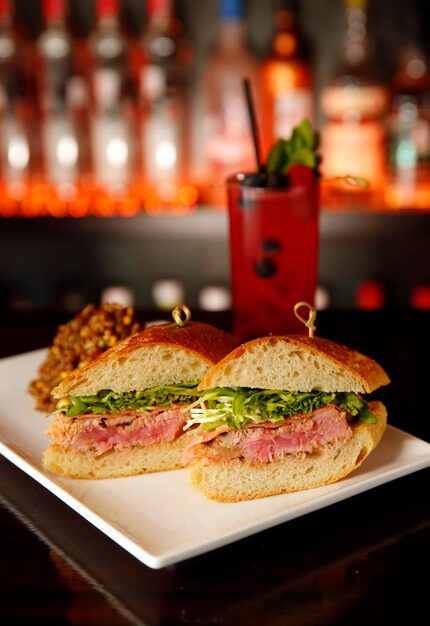 The Ahi Tuna sandwich comes with seared tuna, pickle ginger, radish sprouts, cilantro on a...