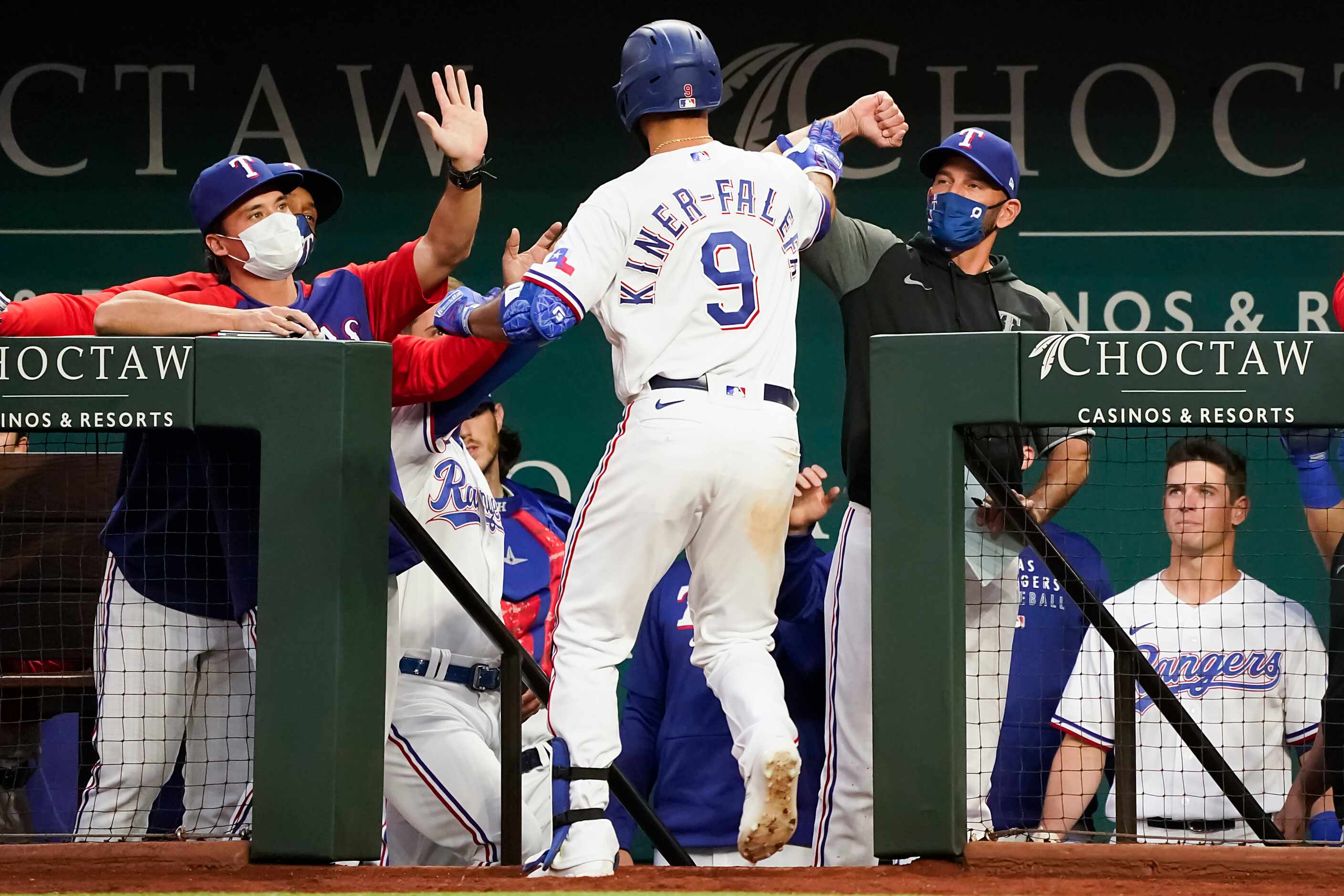 Texas Rangers shortstop Isiah Kiner-Falefa celebrates after hitting a solo home run during...