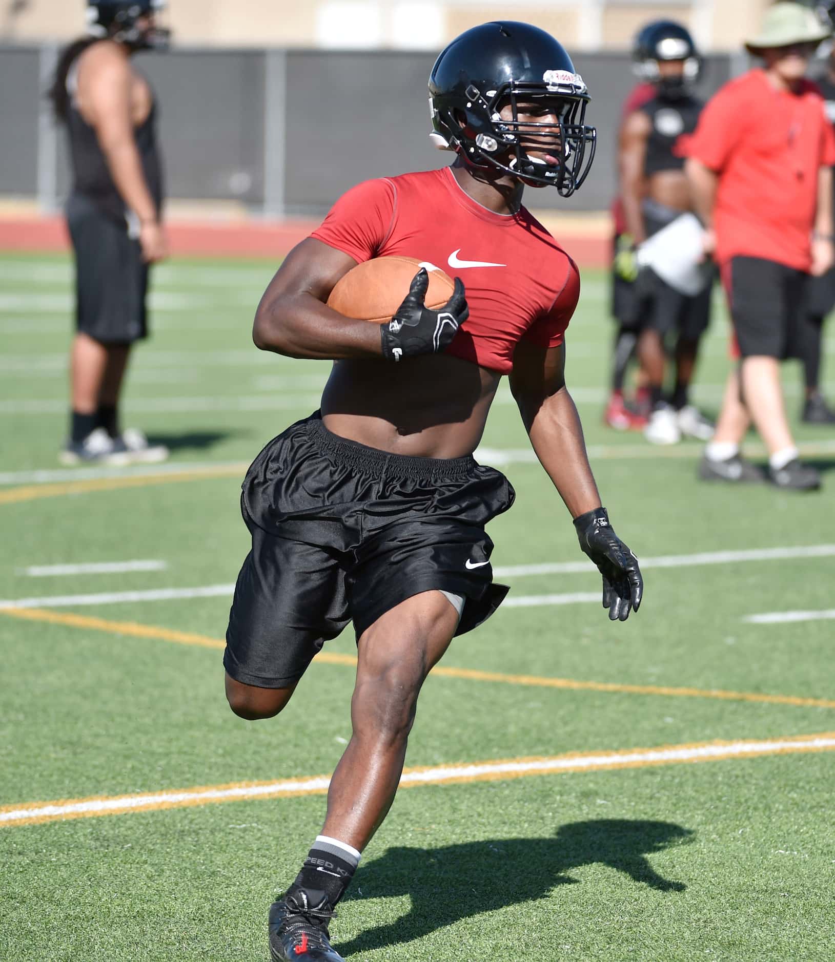 Running back Ja'Ron Wilson runs during Euless Trinity's first day of football practice at...