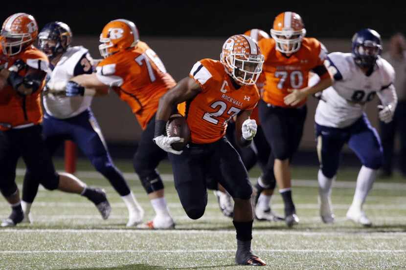 (TXHSFB) Rockwall RB Caleb Broach (27) breaks free for a big gain during the first half of a...