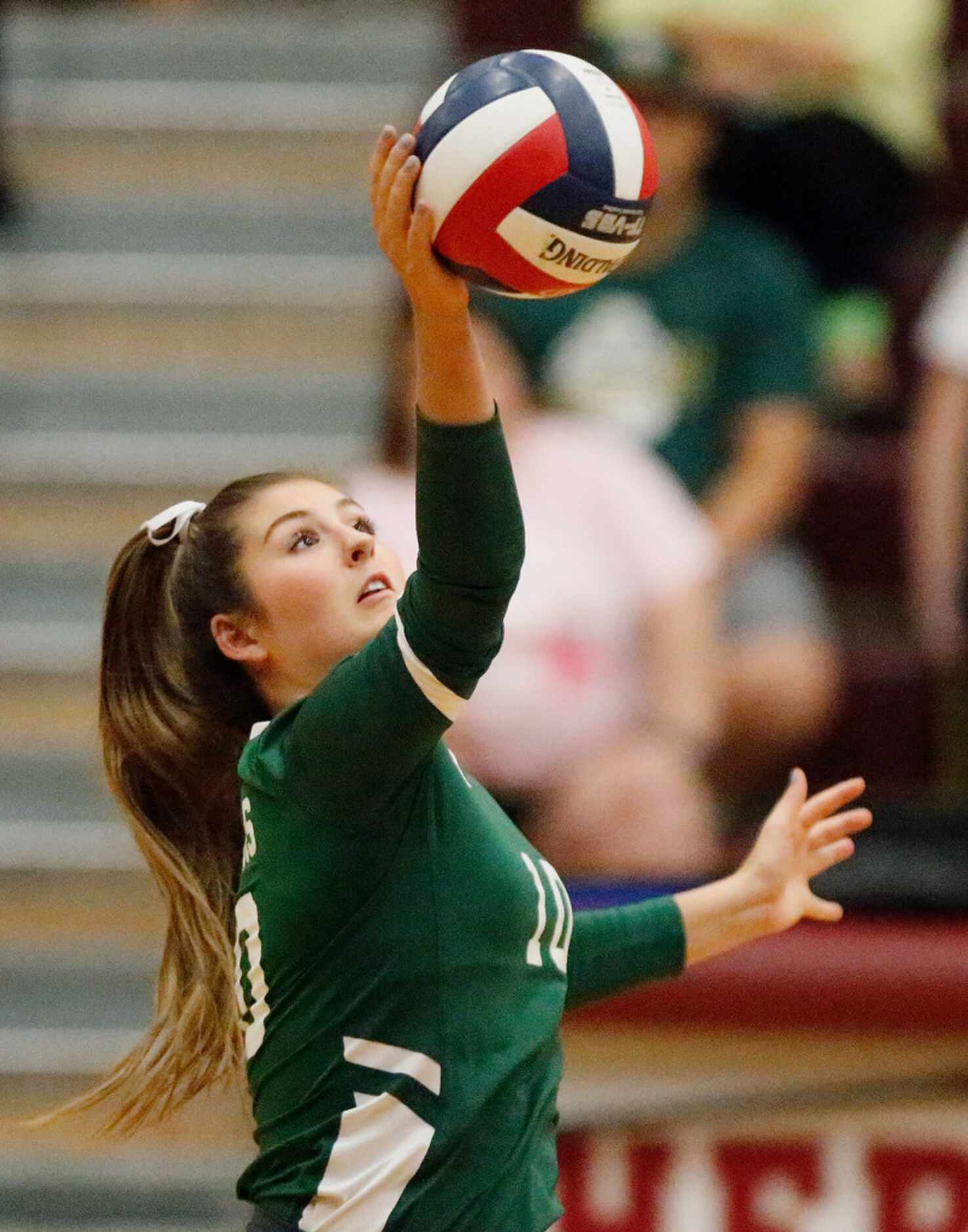 Lebanon Trail High School outside hitter Peyton Thompson (10) gets a hit during game three...
