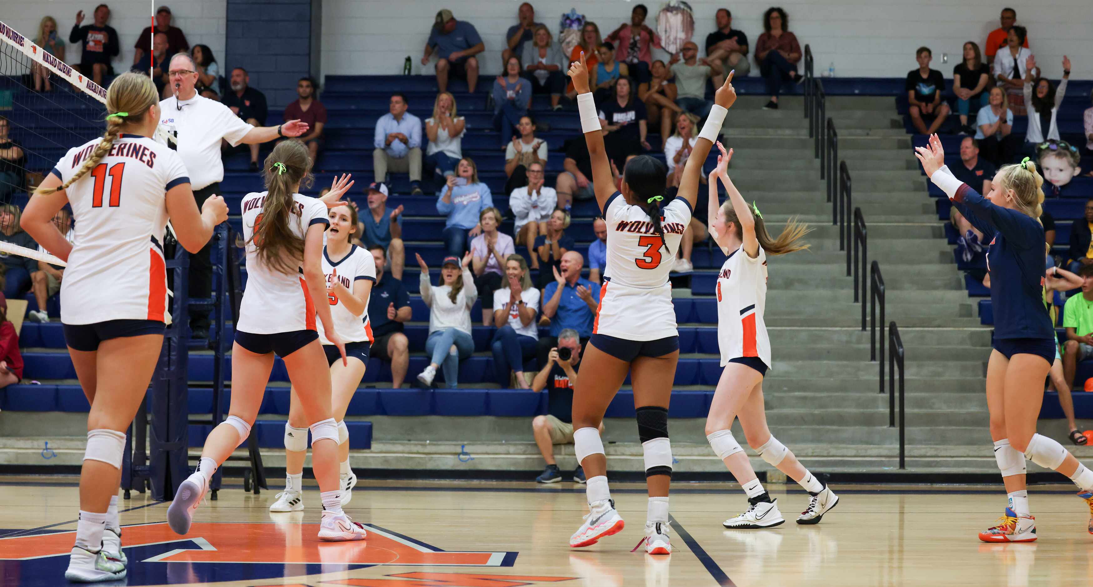 Frisco ISD’s Wakeland High School volleyball team celebrates their win after the third set...
