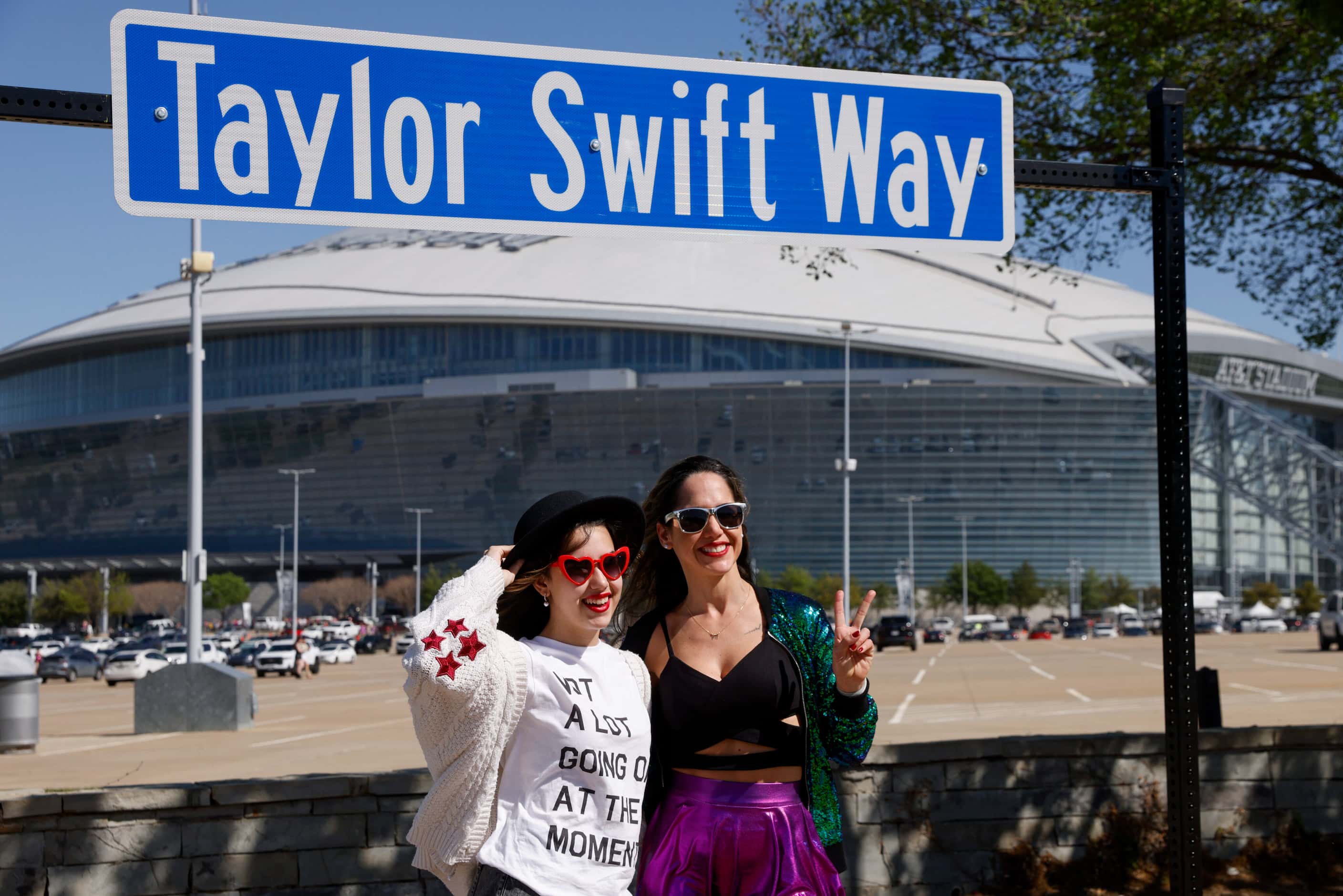 Leticia Angelim, 13 (left), poses for a photo with Flavia Angelim in front of a “Taylor...