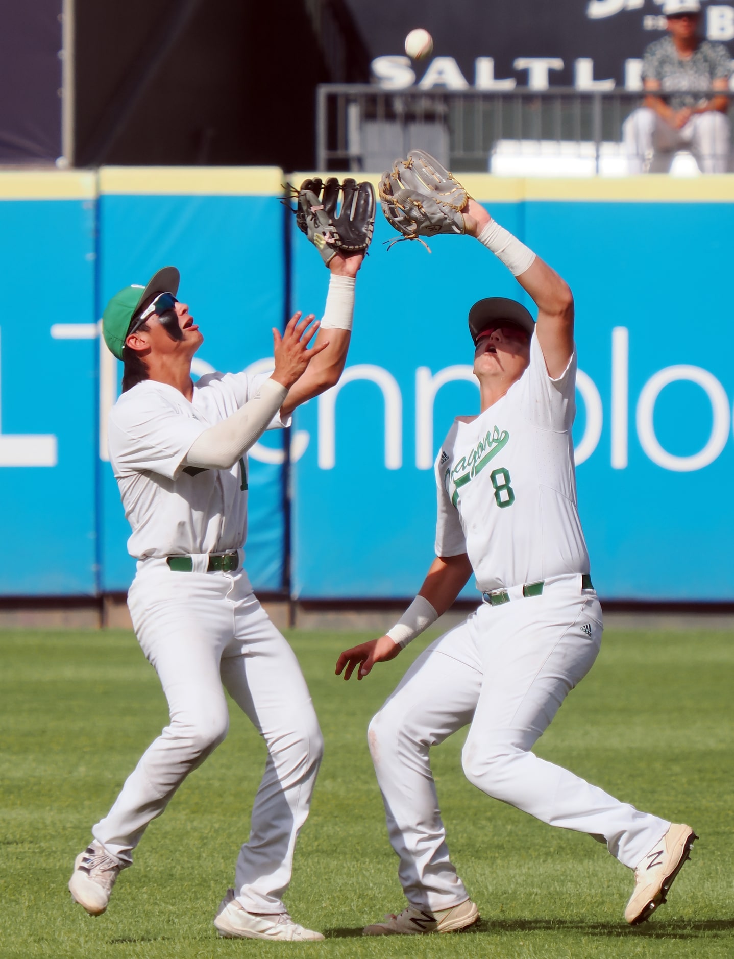 Southlake Carroll second baseman Ben Tryon (8) and short stop Ethan Mendoza (1) go for the...