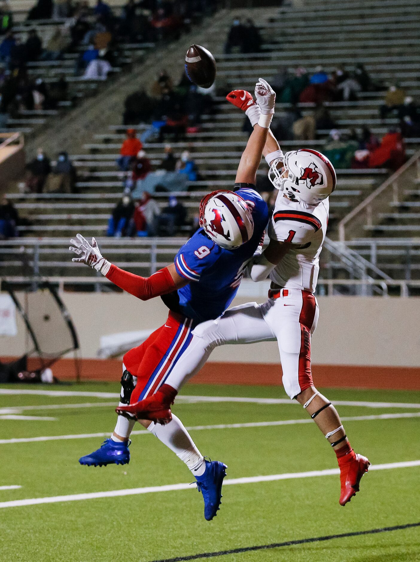 Irving MacArthur senior Roland Jackson (1) breaks up a pass intended for JJ Pearce senior...