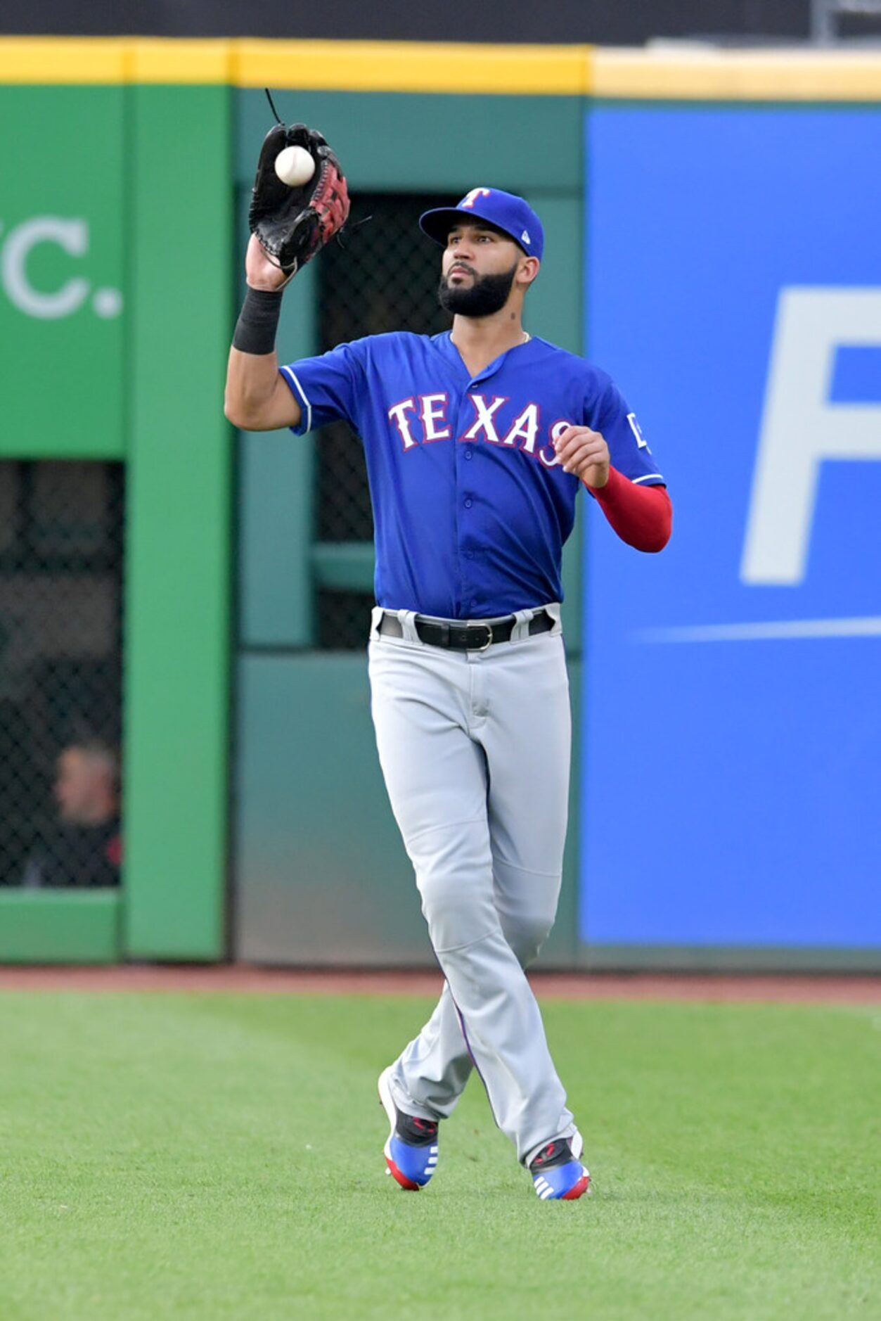 CLEVELAND, OHIO - AUGUST 05: Right fielder Nomar Mazara #30 of the Texas Rangers catches a...