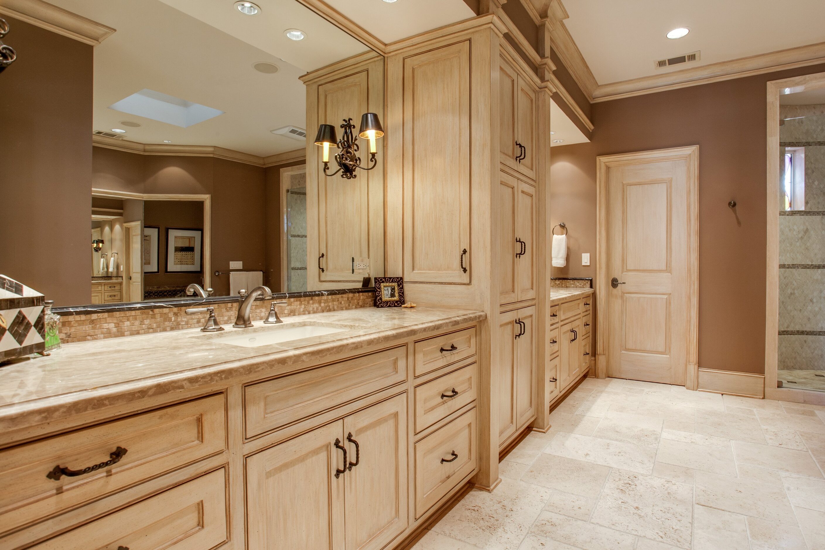 The master bathroom has a jetted tub, his and her vanities, two walk in closets and a double...