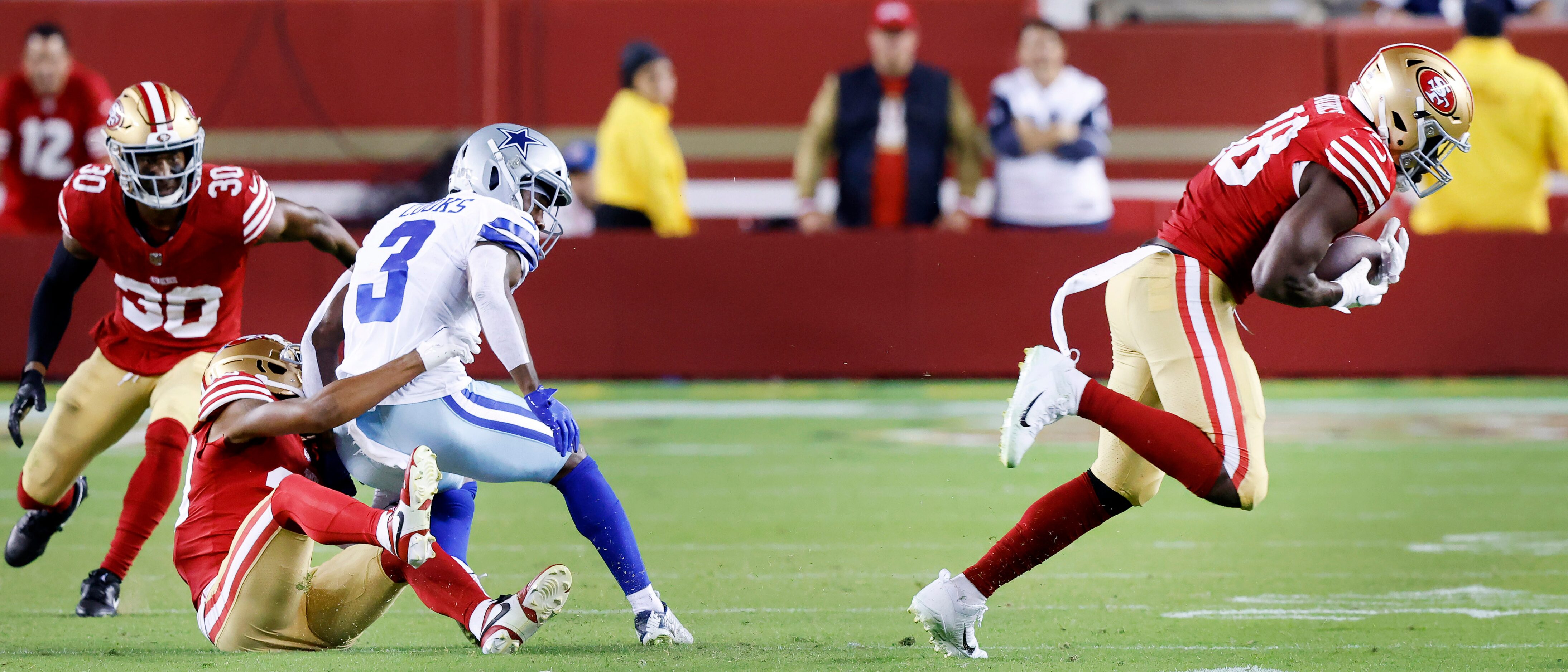 San Francisco 49ers linebacker Oren Burks (48) intercepts a pass intended for Dallas Cowboys...