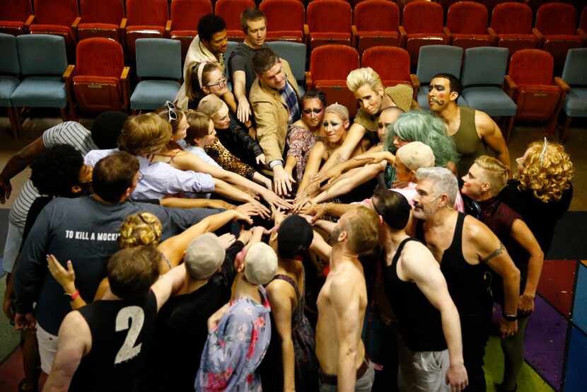 The cast of Pippin cheers before the curtain at The Firehouse Theatre in Farmers Branch on...