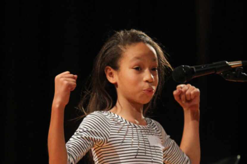 Marisa Dixon, 11, recited her piece in the sixth-grade oratorical contest Friday at  W.H....