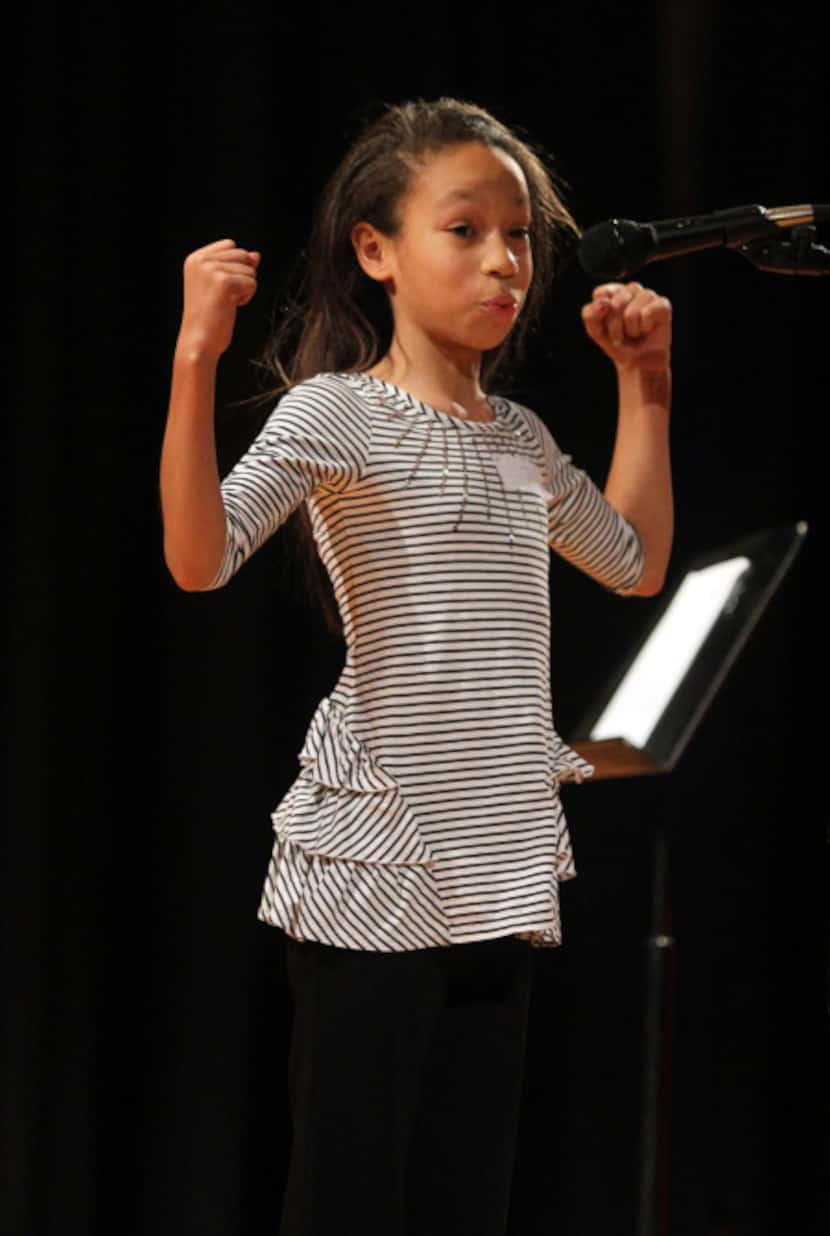 Marisa Dixon, 11, recited her piece in the sixth-grade oratorical contest Friday at  W.H....