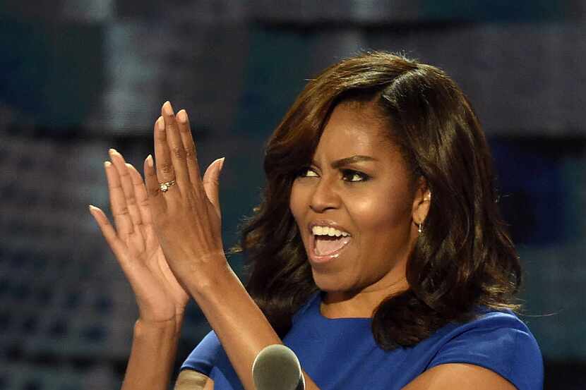 First Lady Michelle Obama clapped with delegates during the Democratic National Convention...