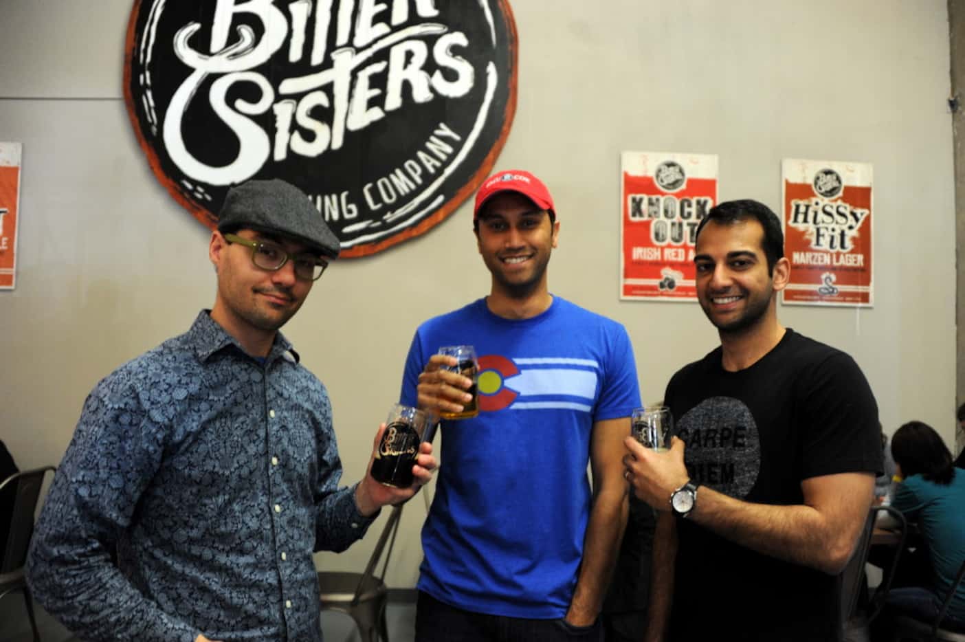 Friends enjoy some cold beer at the opening of Bitter Sisters Brewing Company in Addison on...