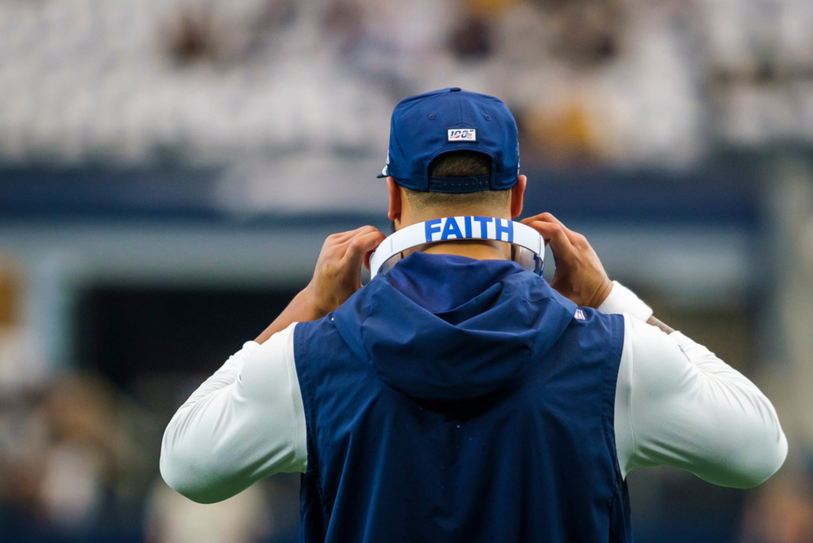 Dallas Cowboys quarterback Dak Prescott warms up before an NFL football game against the...