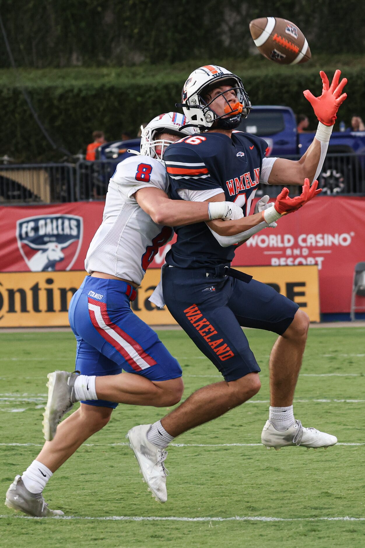 Grapevine High School’s  Redmond Webb (8) grabs Wakeland High School’s Hayden O’Neal before...