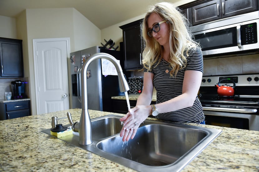 Meghan Avigliano says the tap water at her home in Ponder is causing her skin to break out...