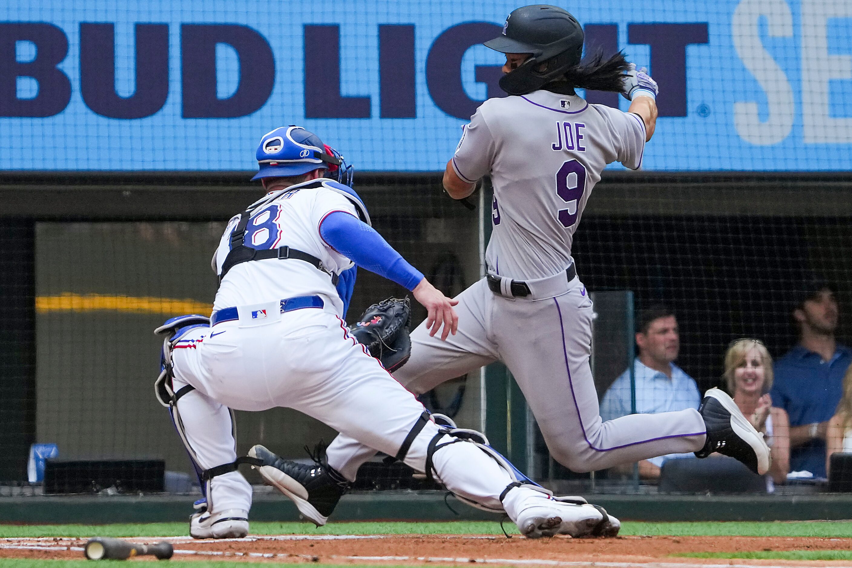 Colorado Rockies designated hitter Connor Joe (9) is out at home as Texas Rangers catcher...