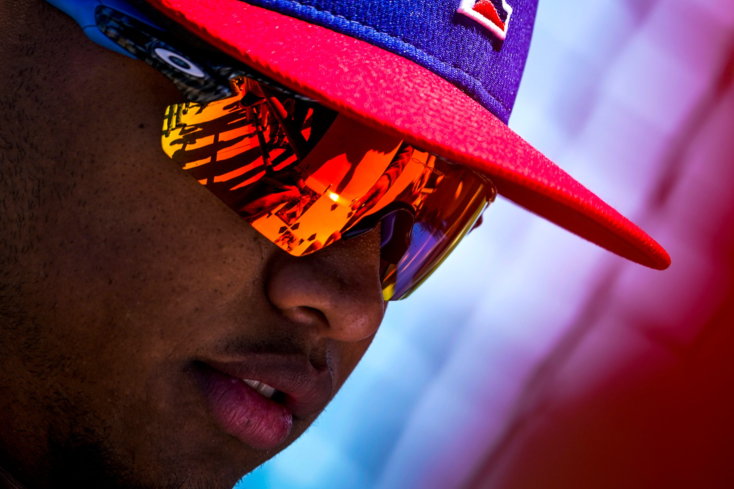 Texas Rangers outfielder Willie Calhoun signs autographs for fans during a spring training...