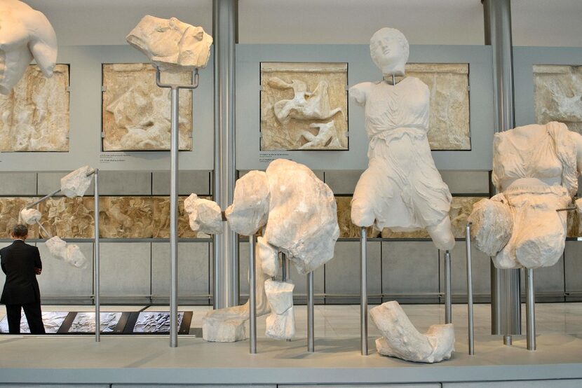 President Barack Obama looks at an exhibit during a tour of the Acropolis Museum on November...